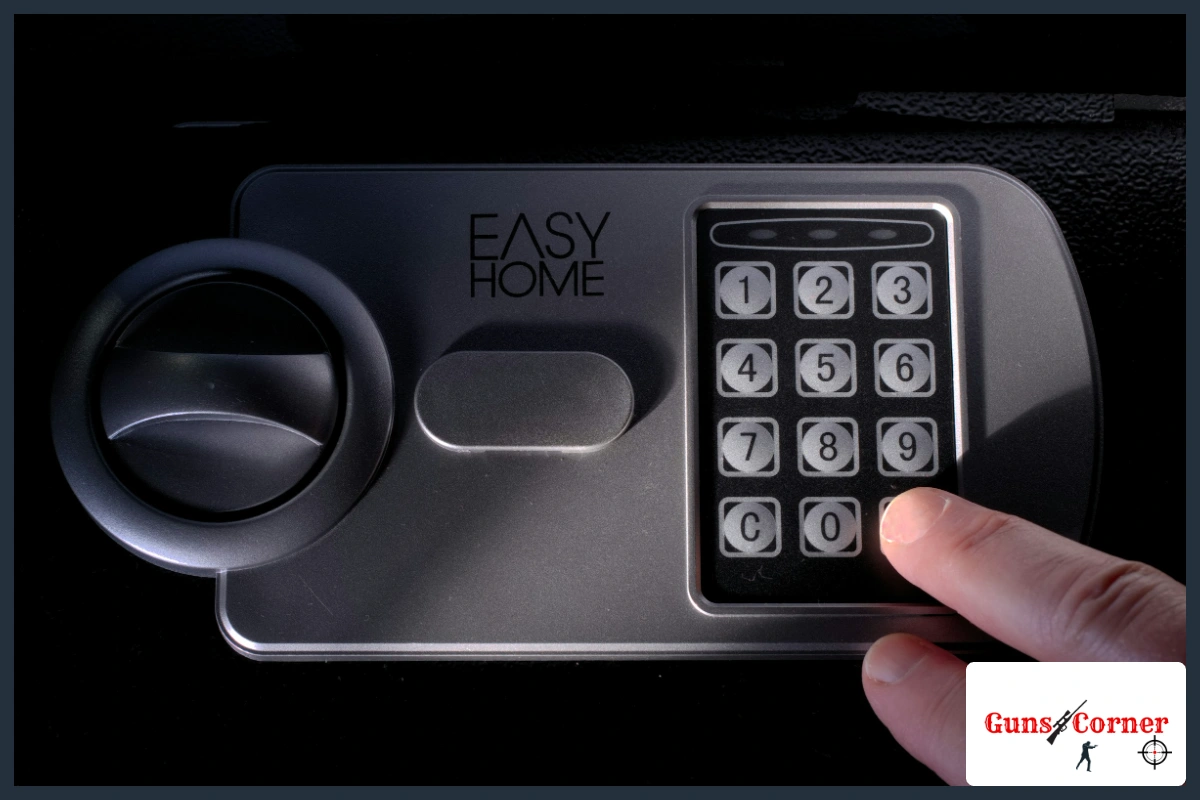 Close-up of an electronic keypad lock and handle on a small steel safe