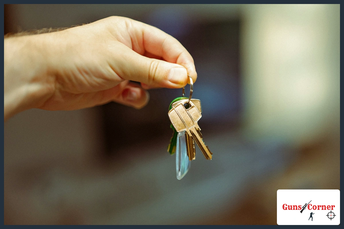 Hand holding a small ring of house keys